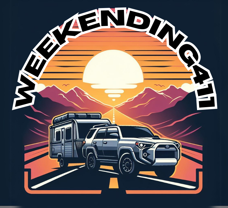 Travel trailer on the road driving during golden hour through the mountains.